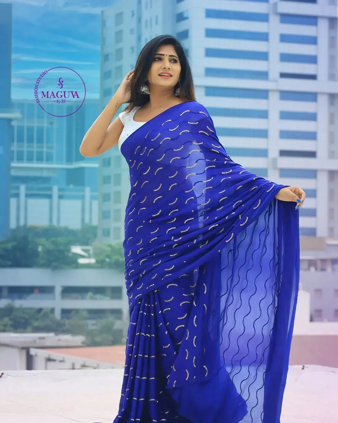 Vasanthi Krishnan Wearing Blue Saree White Sleeveless Blouse